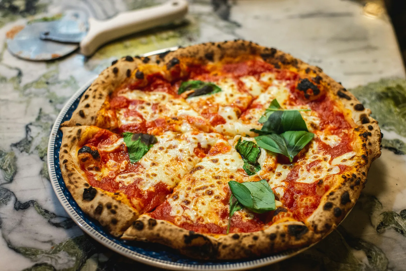 Hand-stretched pizza dough prepared fresh daily at Crazy Cheezy Pizza